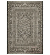 Dark ornate patterned machine washable rug.